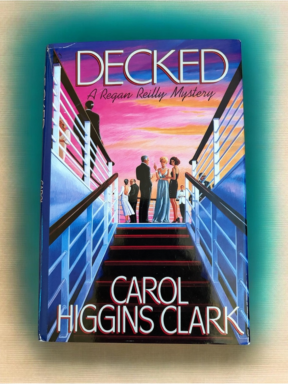 Decked by Carol Higgins Clark - Pink & Blue Hardcover Book